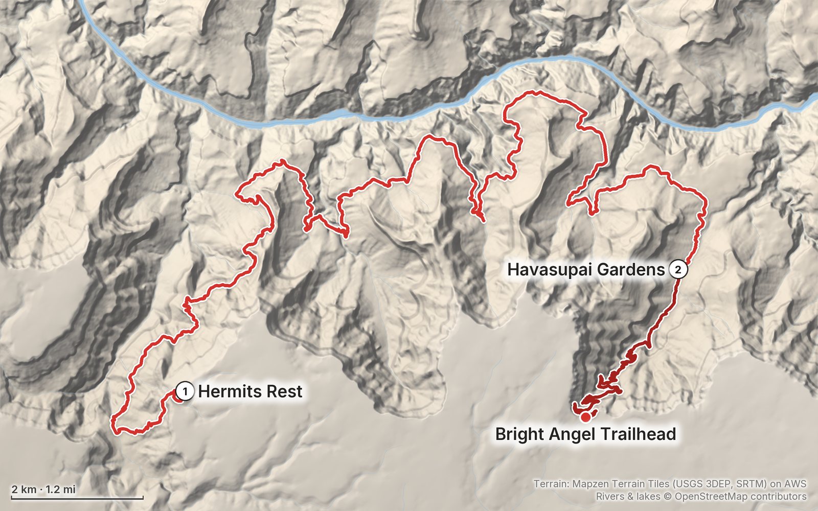 Relief map of the Grand Canyon Tonto Trail route: 2 days drawn in red with numbered day starts, labelled Hermits Rest, Bright Angel Trailhead and Havasupai Gardens.