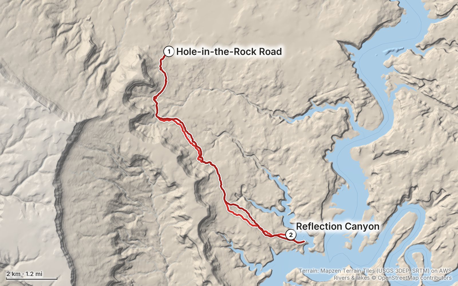 Relief map of the Reflection Canyon route: 2 days drawn in red with numbered day starts, labelled Hole-in-the-Rock Road and Reflection Canyon.