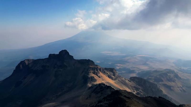 Popocatépetl through the evening haze, from my drone above the ridge near the hut, Day 1.