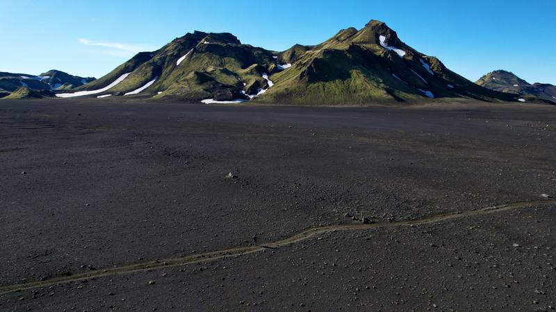 The trail across the black sand below the mountains, Day 2.