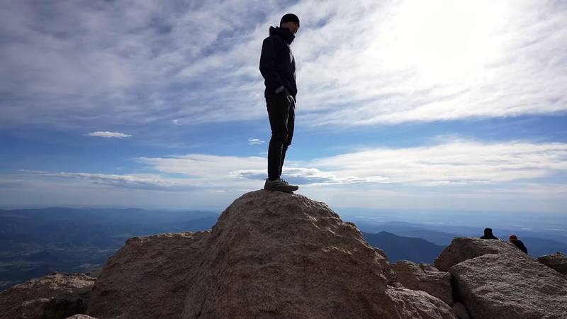 On a rock at the edge of the summit, Day 2.