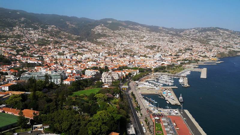 Funchal from above: the hotels, the marina and the hills behind.