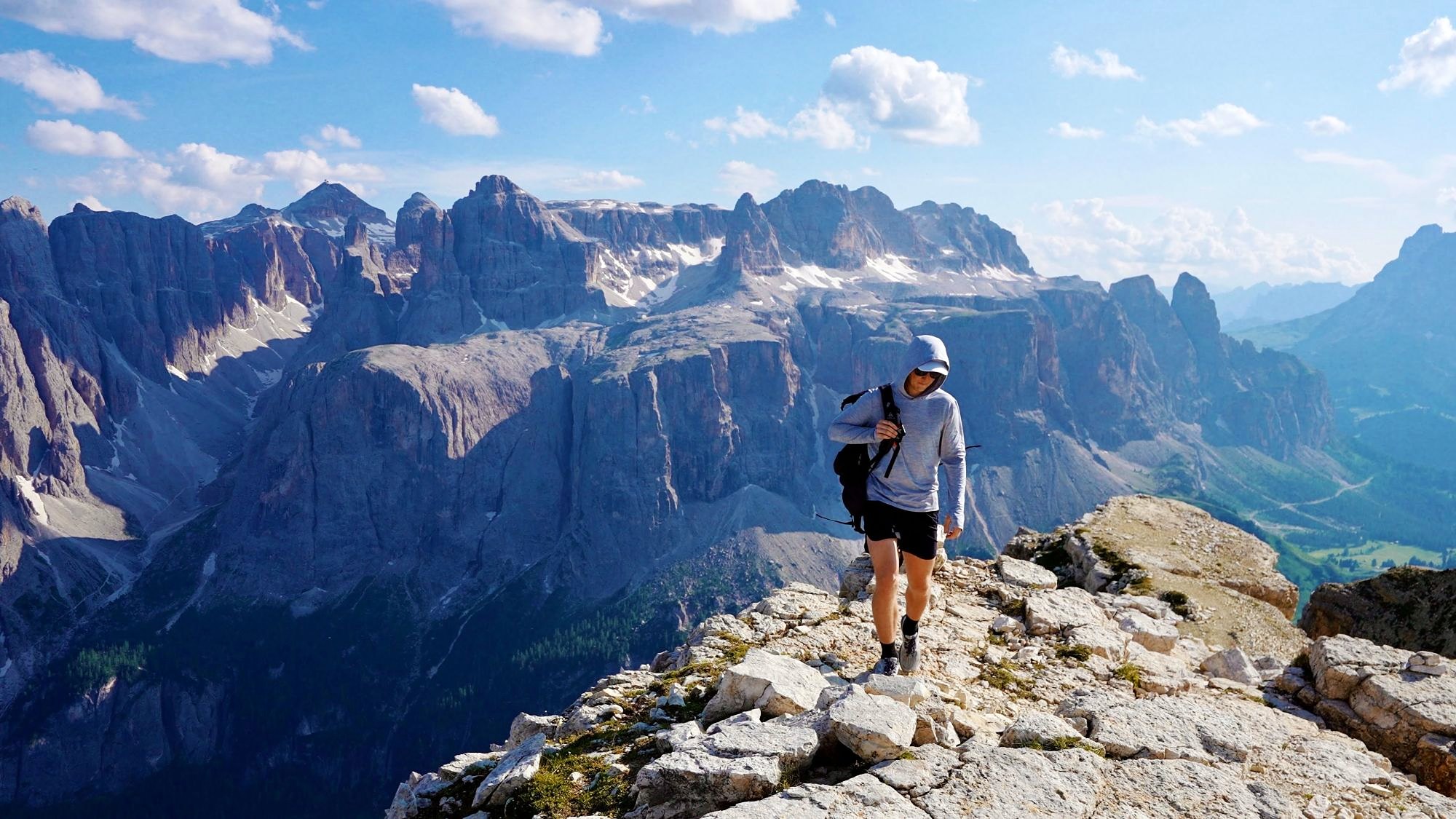 Kraig hiking along a rocky ridge in the Dolomites