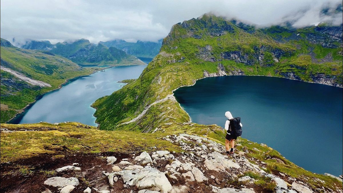 Kraig hiking above a lake in the Lofoten Islands